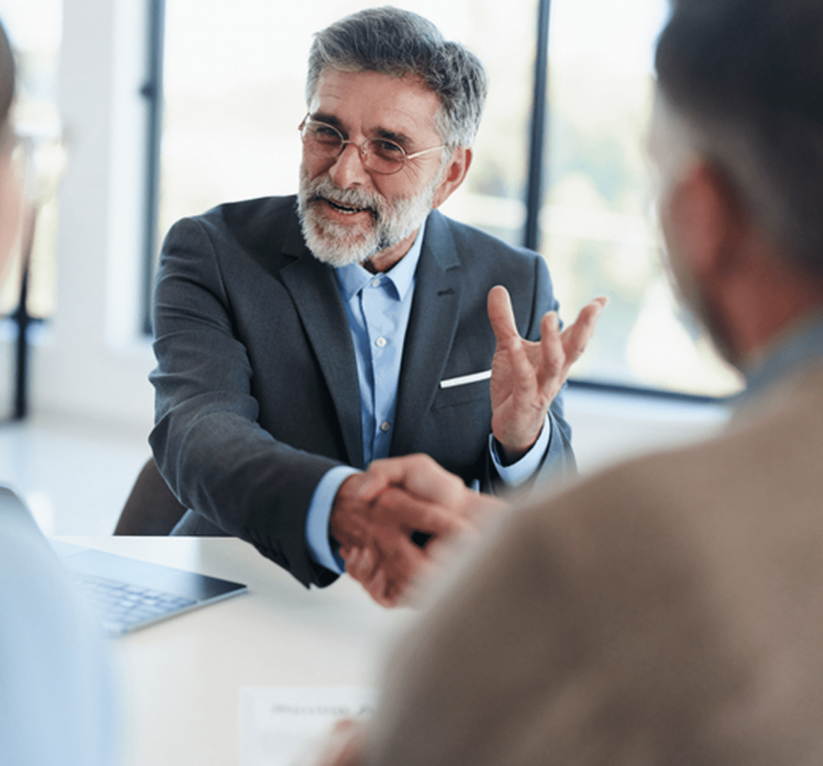 Mature man in formal discussion