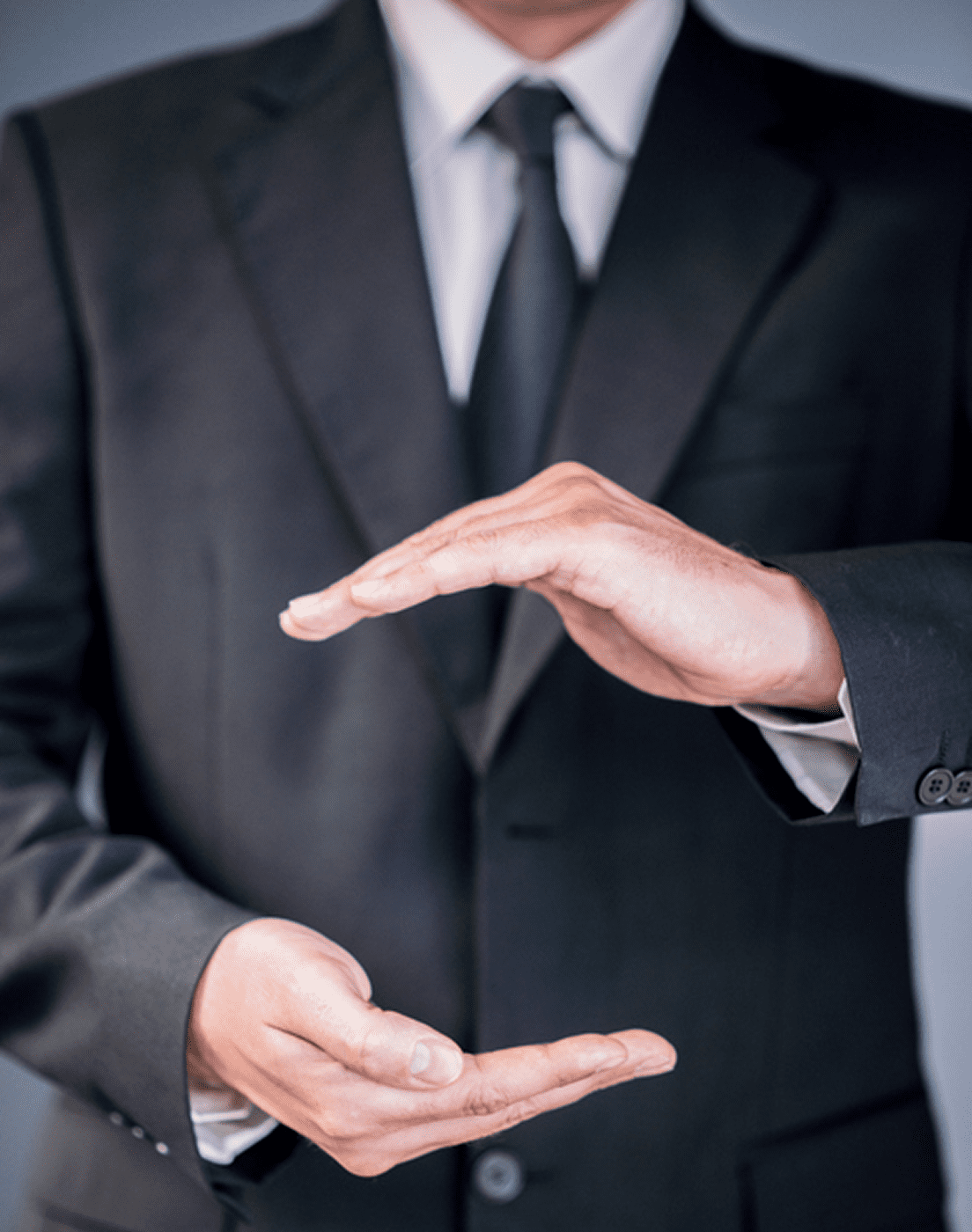 Businessman gesturing with hands in suit