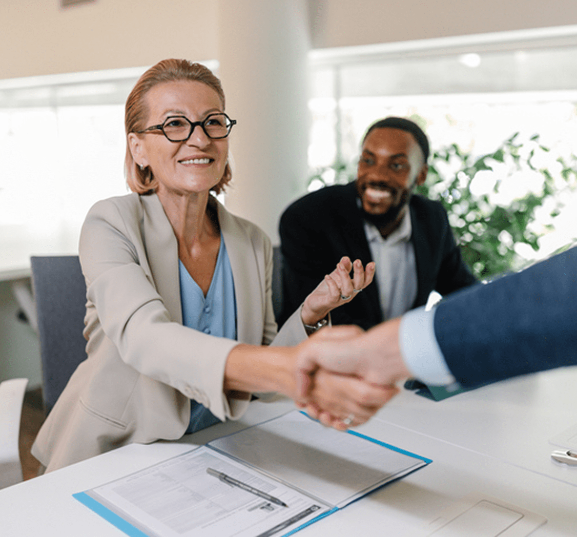 Business handshake in meeting